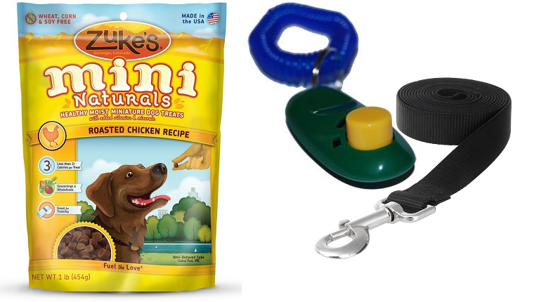 A pack of Zuke's Mini Naturals treats next to a clicker and a leash.